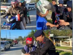 Semarak Merah Putih: Brimob Polda Sultra Bagikan dan Pasangkan Bendera kepada Pengguna Jalan Sambut HUT RI ke-80